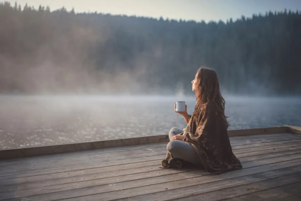 A girl having a cup of tea. 