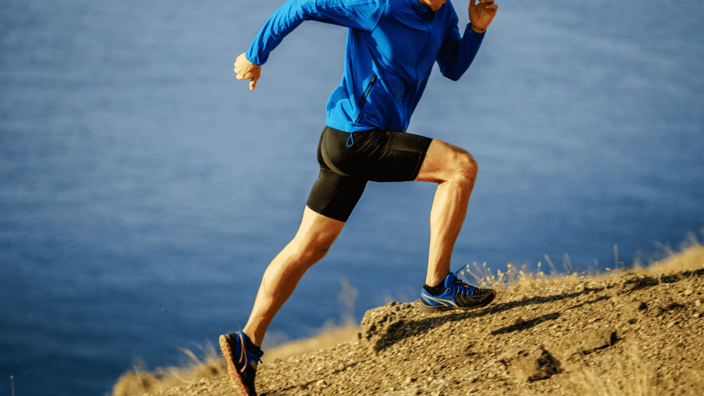 Try CBD for Foot Pain, man running against mountain slope. 